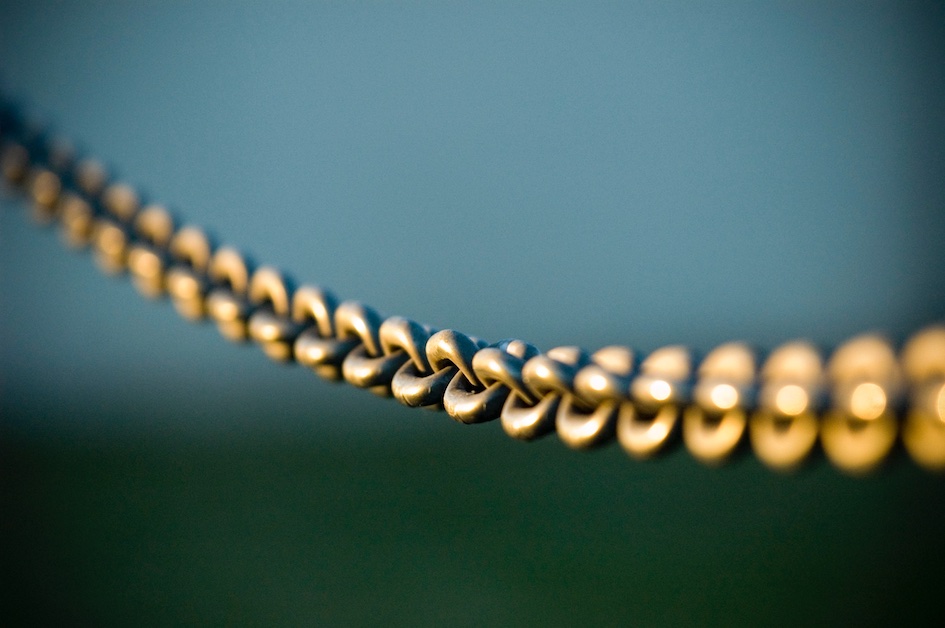 Chain links with sunshine on them